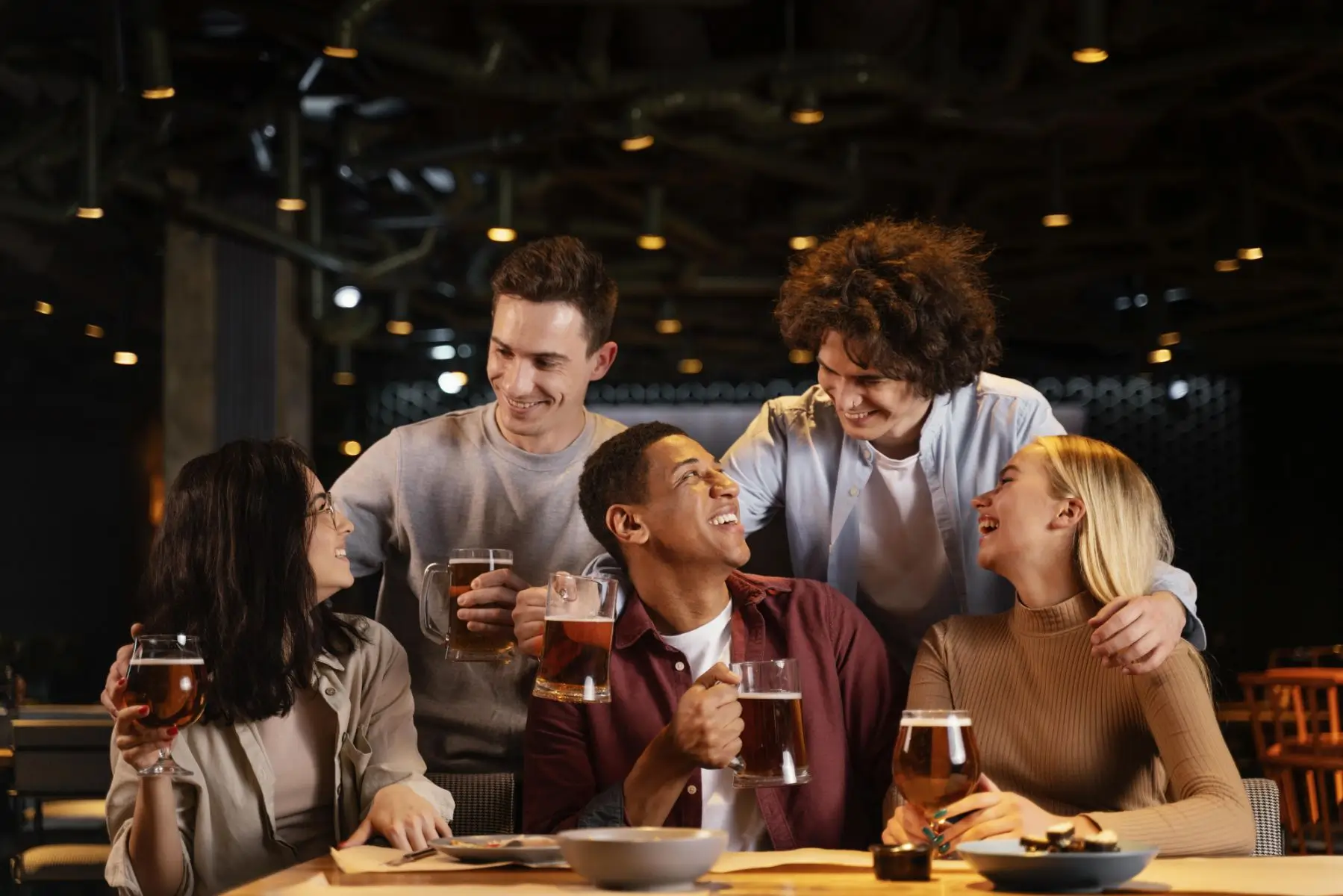 medium-shot-happy-friends-sitting-pub